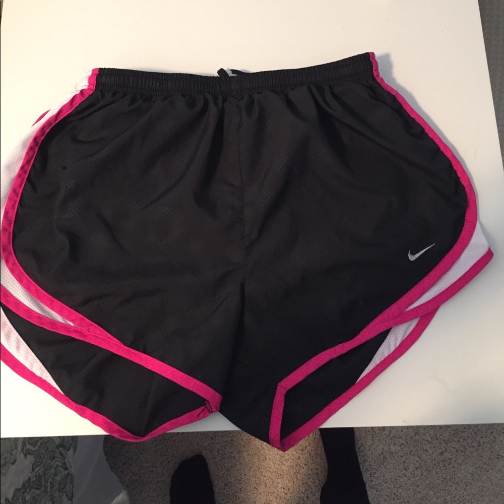 2 pairs of Nike woman's running shorts.Black& pink